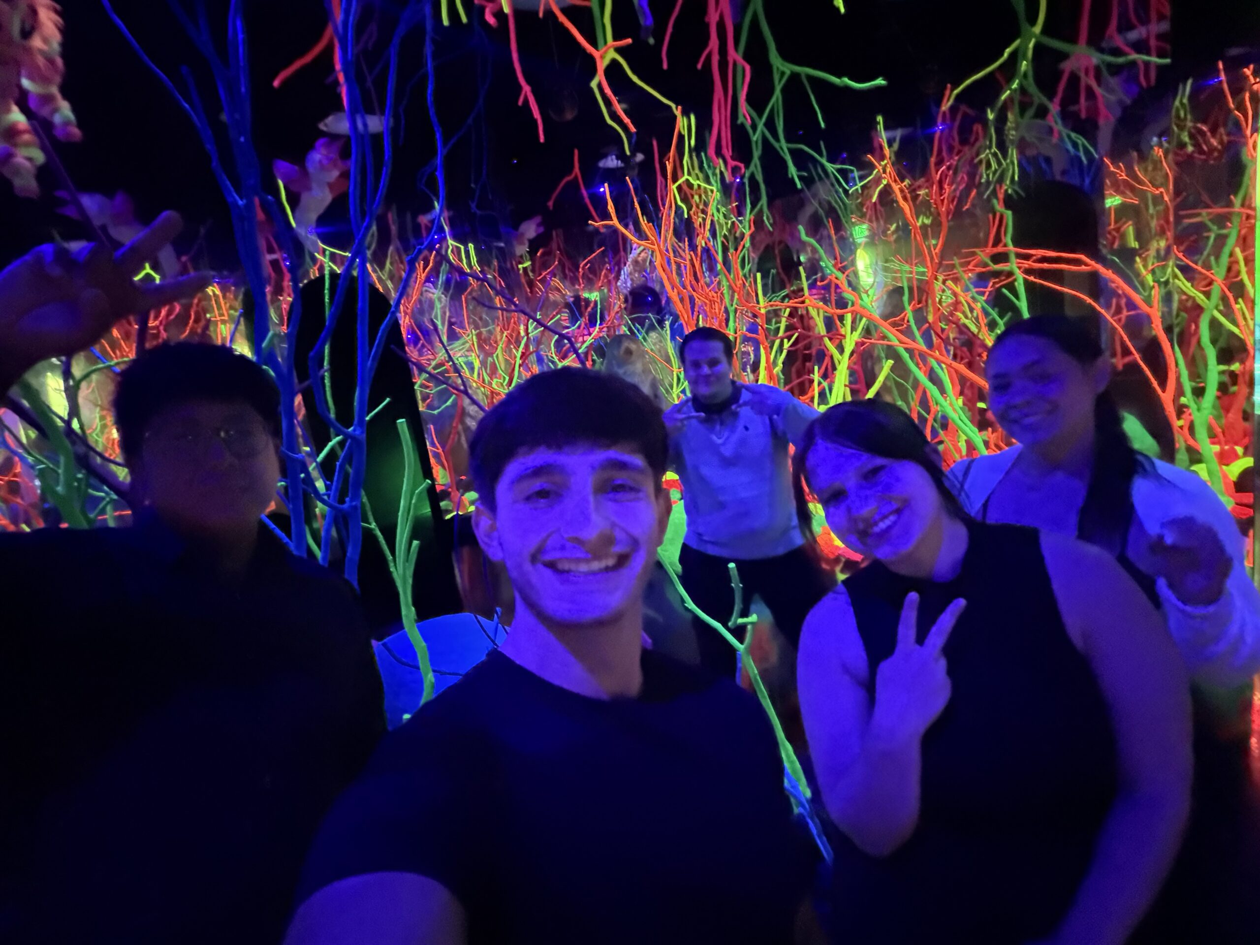 Elevate Marketing team members celebrating together at a company event, highlighting teamwork, professional connections, and workplace culture.