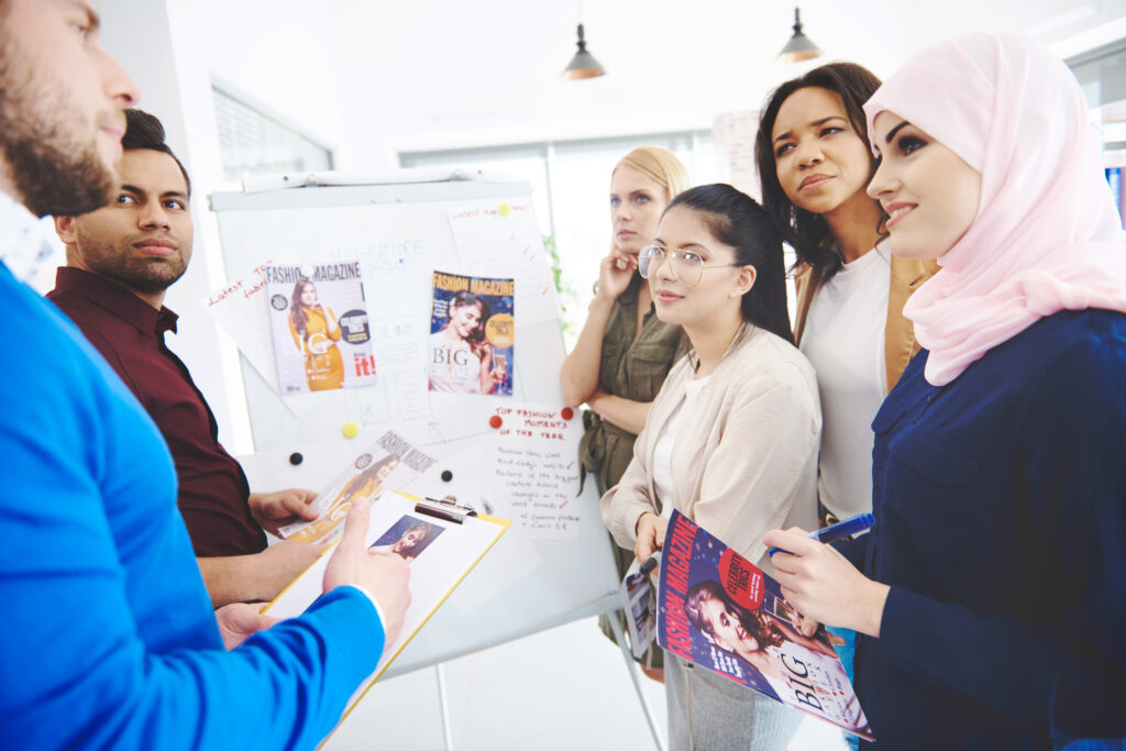 A marketing team planning their online and offline campaign strategies